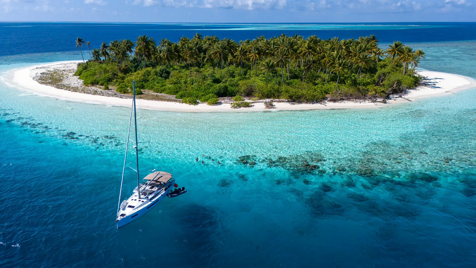 S/Y Infinitea anchored off a Maldivian island